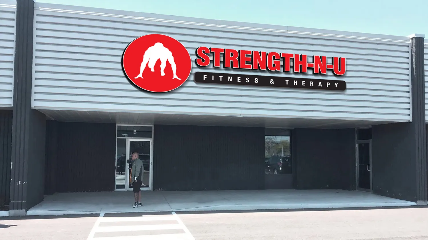 Exterior design project for Strength-N-U. Designed storefront with a bold channel letter lightbox on a huge existing facade